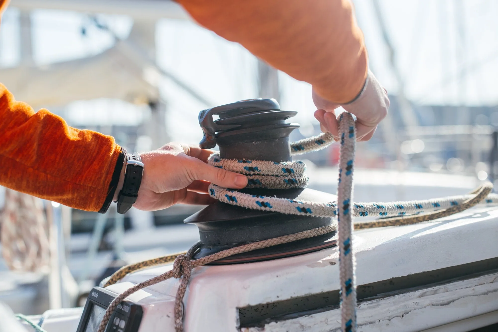 Surveyor inspecting a sailing winch and running rigging on deck